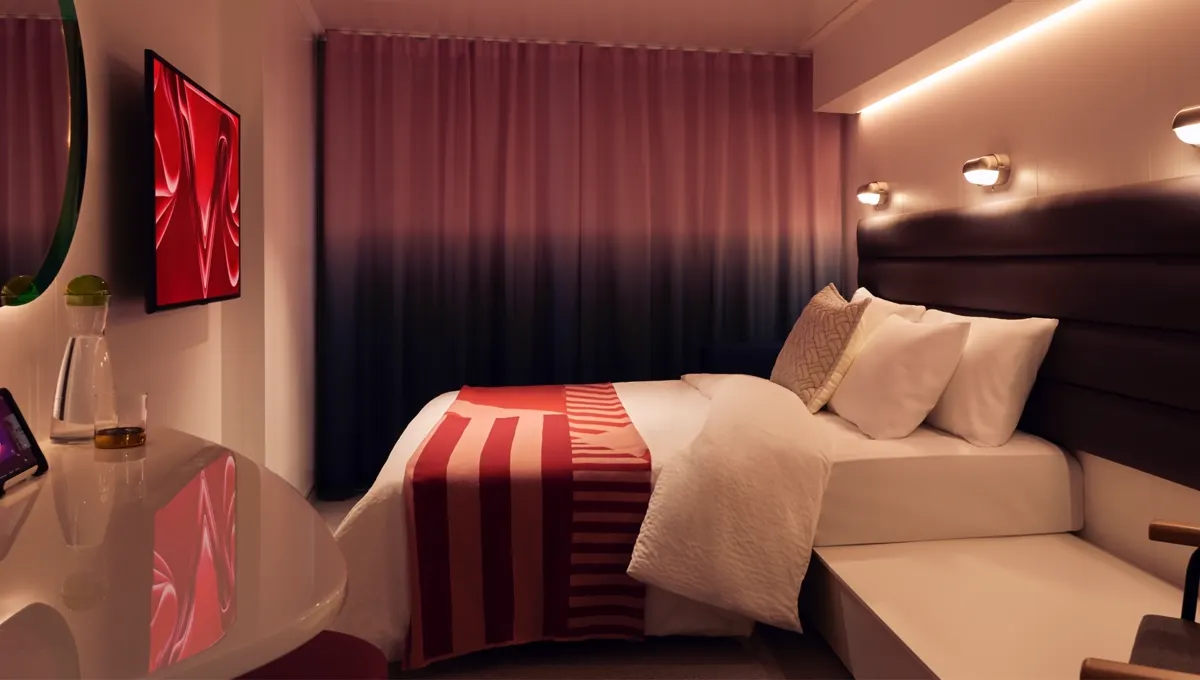 Sea Terrace cabin interior at night on a Virgin Voyages ship