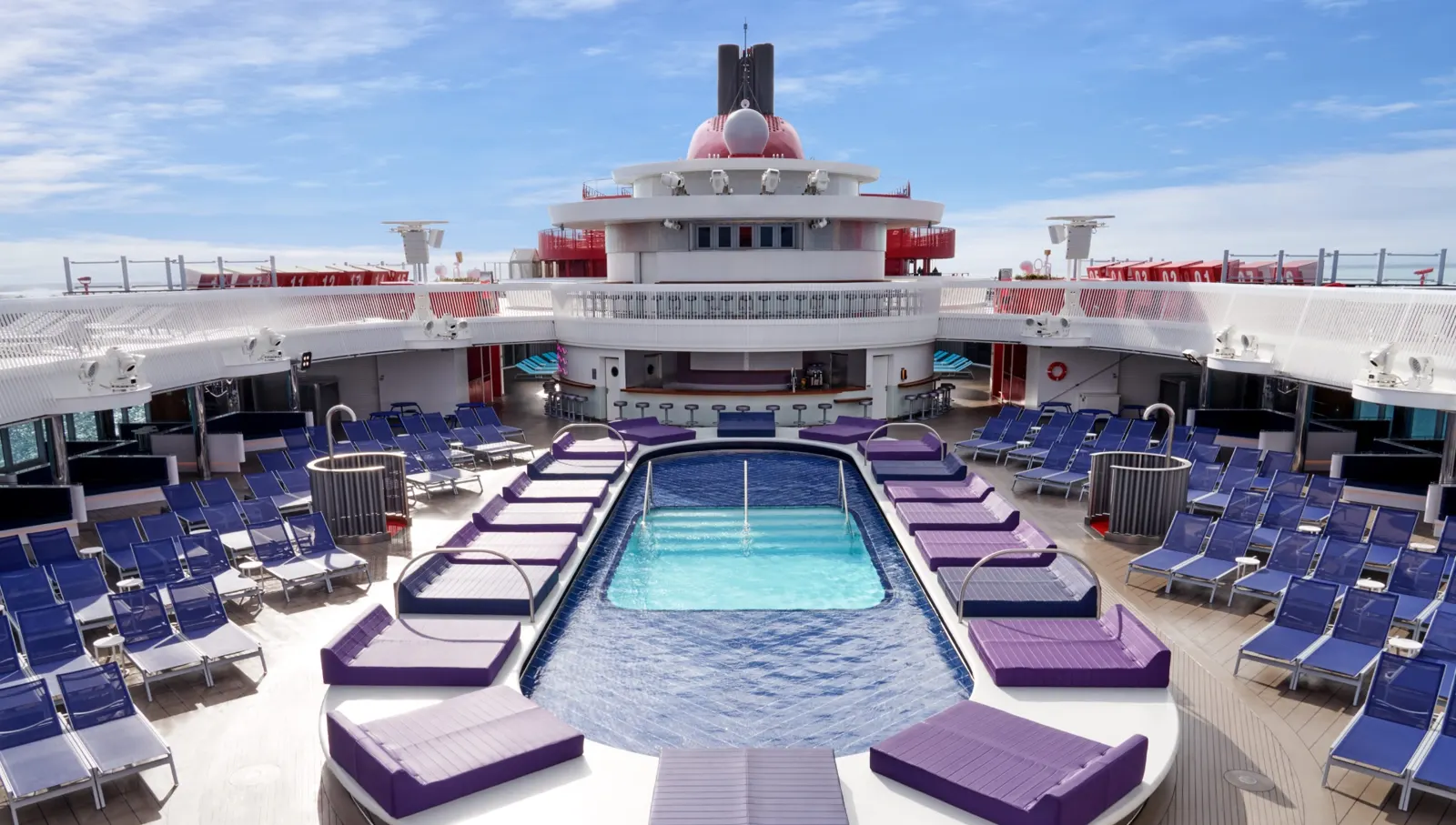 Adults-only Aquatic Club pool deck on a Virgin Voyages ship